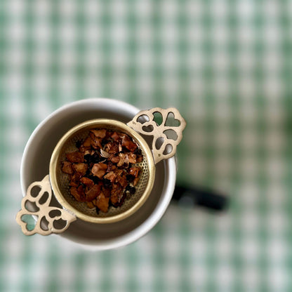Compact brass tea strainer without handle by Vaarsa London