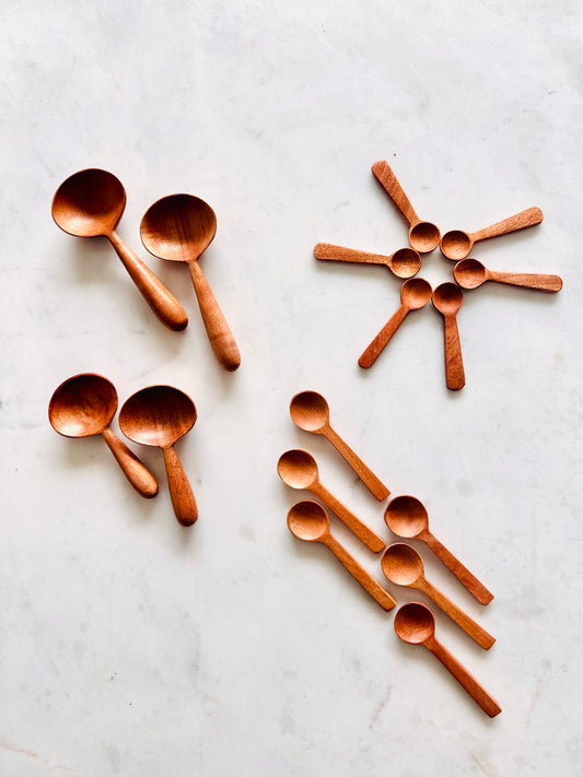 Wooden spoons arranged on a marble surface
